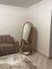 Capsule-Shaped Full-Length Mirror in a Natural Wood Frame for Bedroom